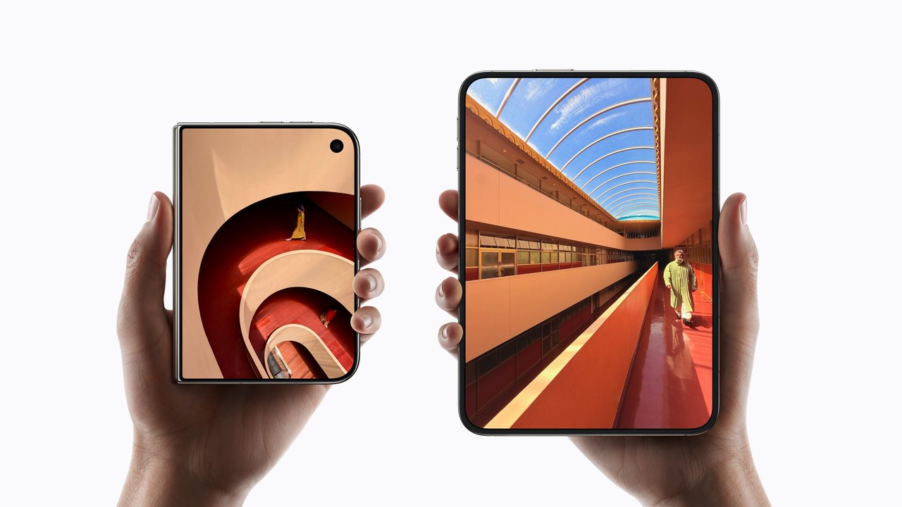 Two hands holding iPhone Duo phones, one folded shut and one open to its 7.6-inch inner screen
