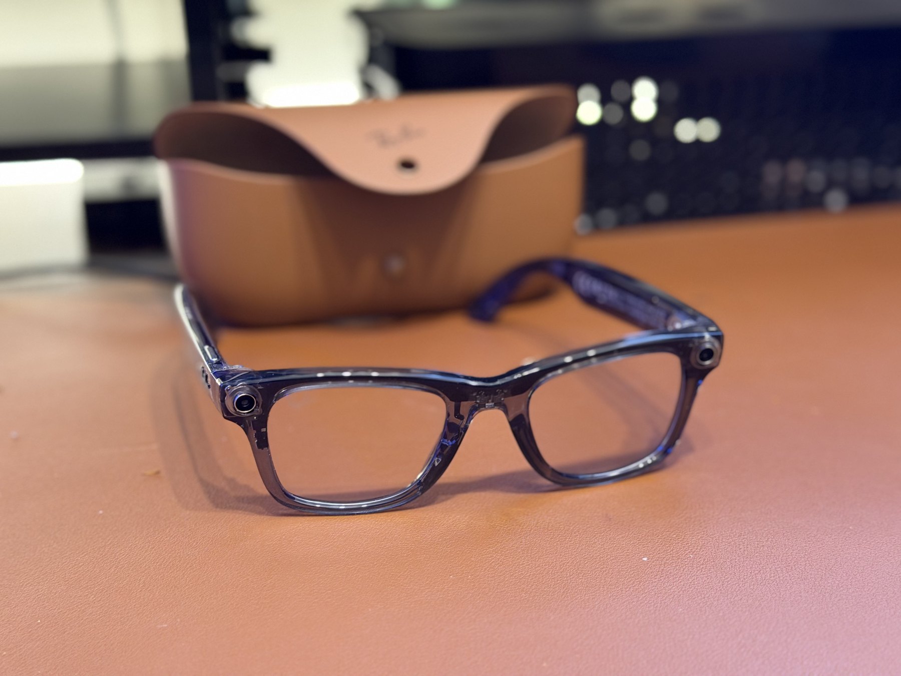 The Ray-Ban Meta Gen 2 Wayfarer on my desk mat, charging case behind